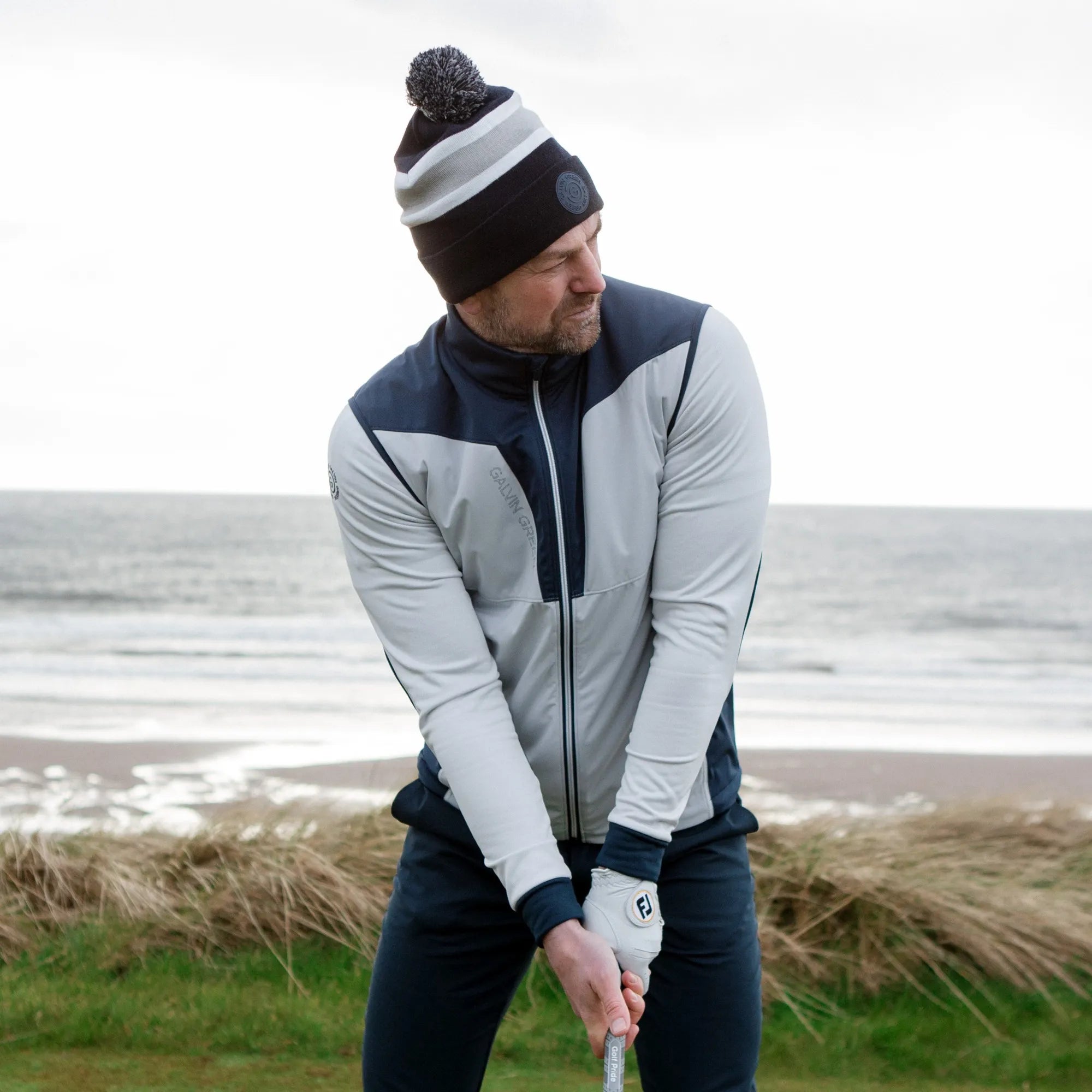 Lathan is a Windproof and water repellent golf vest for Men in the color Cool Grey/Navy(9)