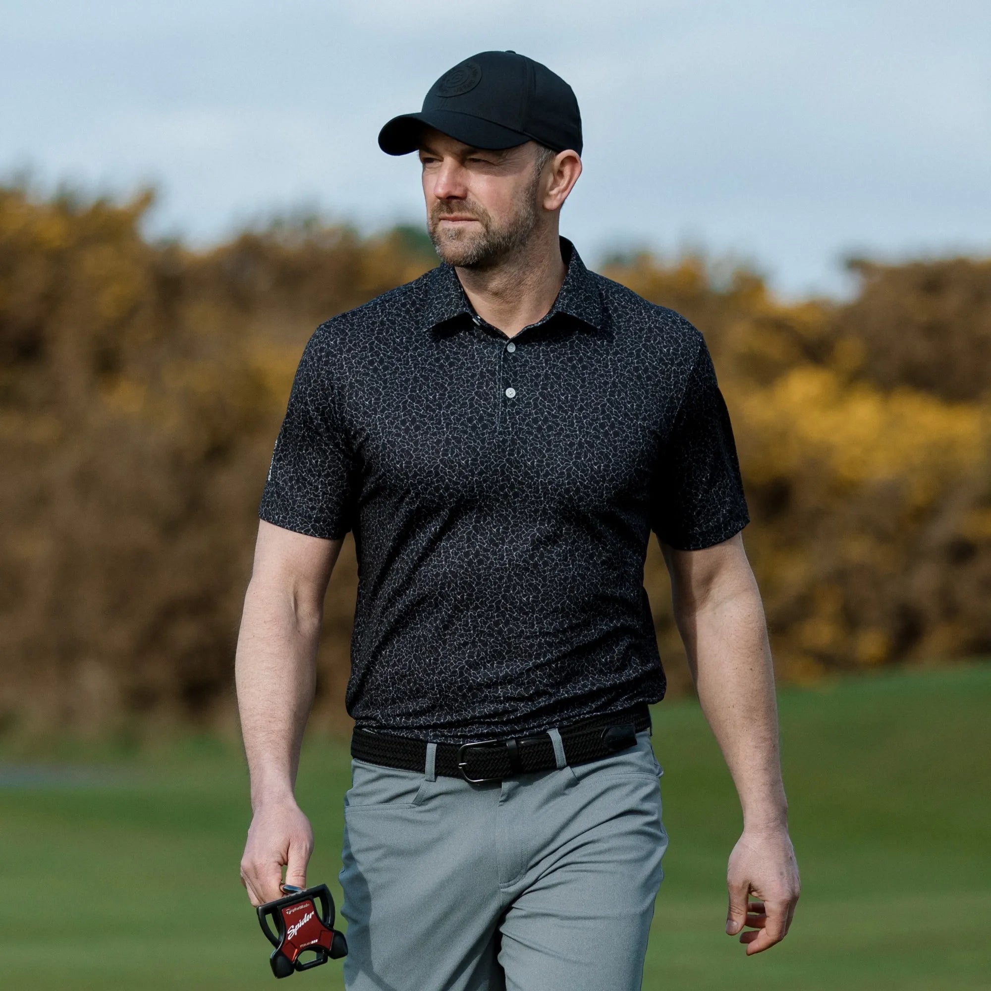 Mani is a Breathable short sleeve golf shirt for Men in the color Black(8)