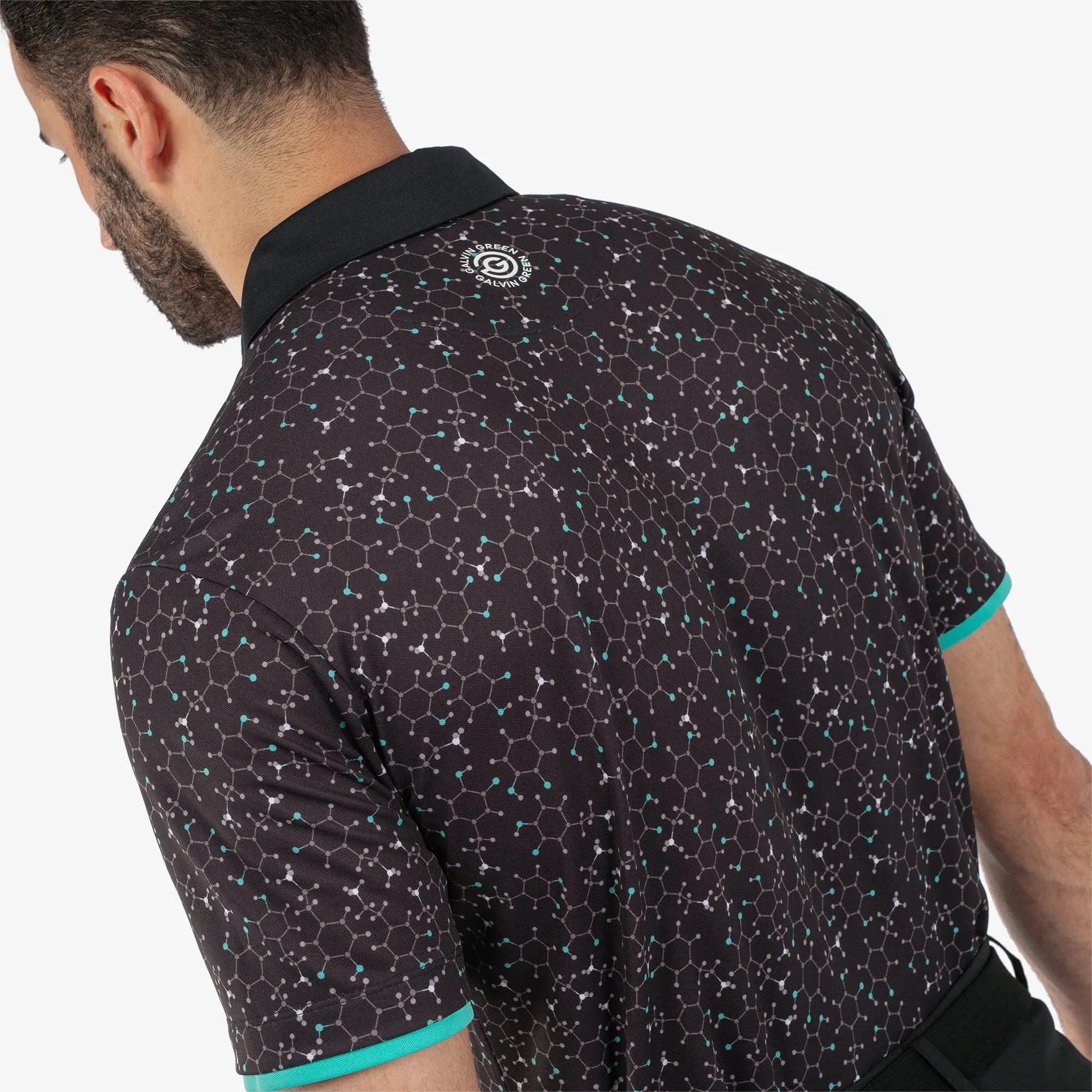 Mannix is a Breathable short sleeve golf shirt for Men in the color Black/Atlantis Green(5)