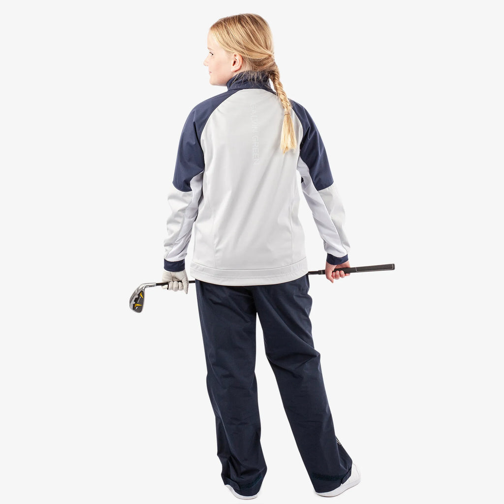 Remi is a Windproof and water repellent golf jacket for Juniors in the color Cool Grey/Navy/White(8)