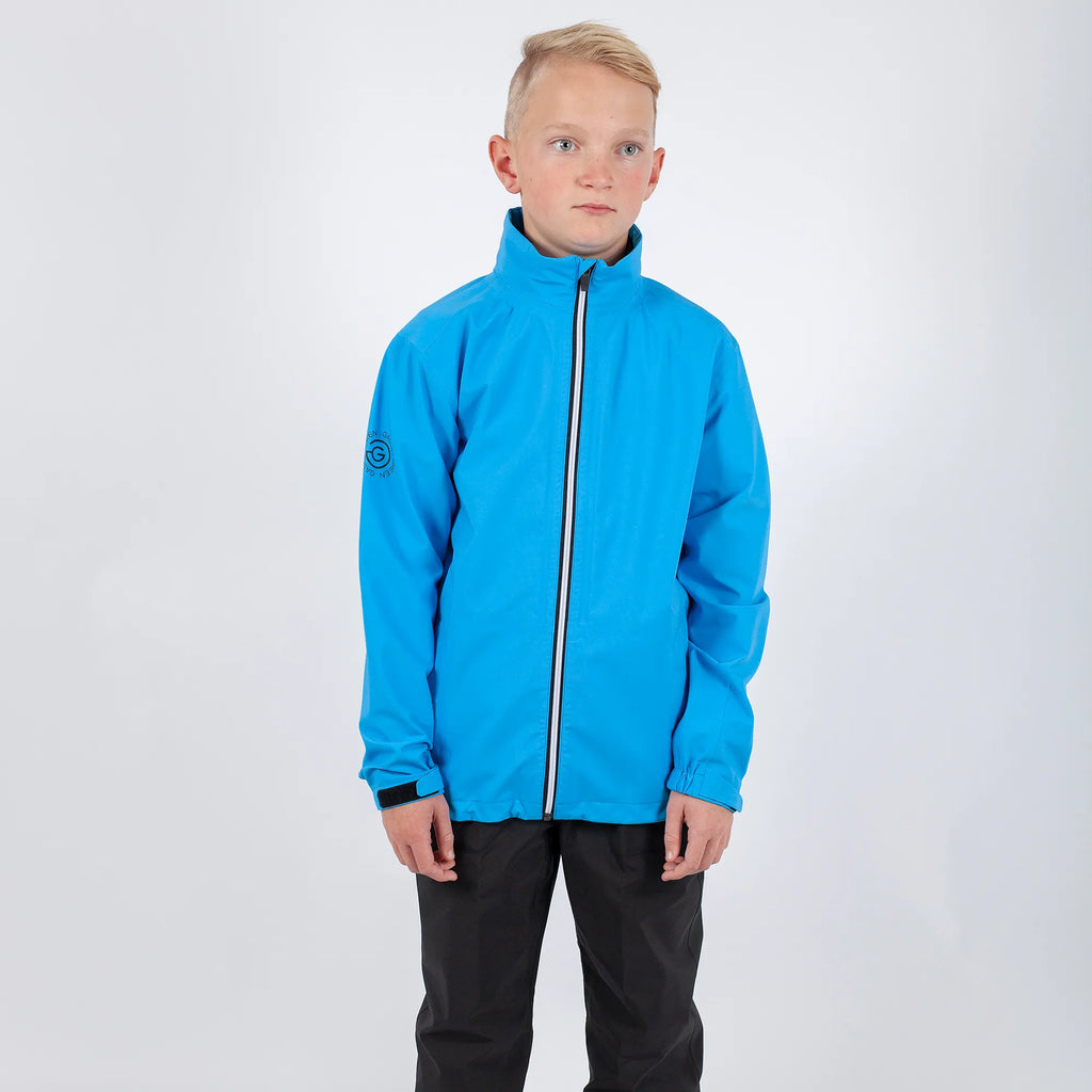 River is a Waterproof golf jacket for Juniors in the color Blue Bell(1)